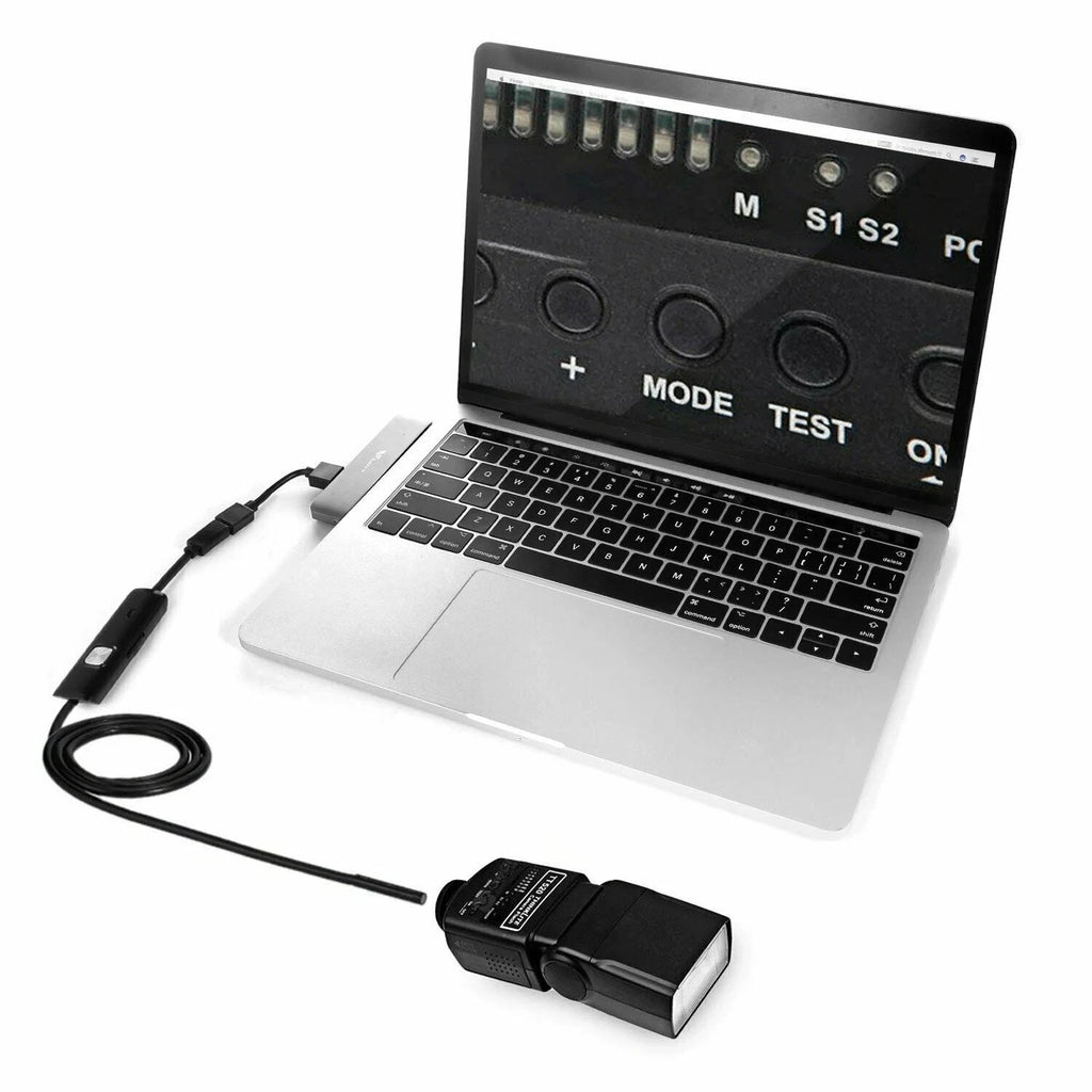 USB endoscope control adapter with cable connected to a laptop