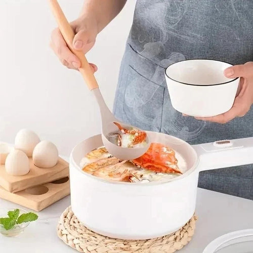 Silicone ladle spoon with wooden handle held above bowl of food