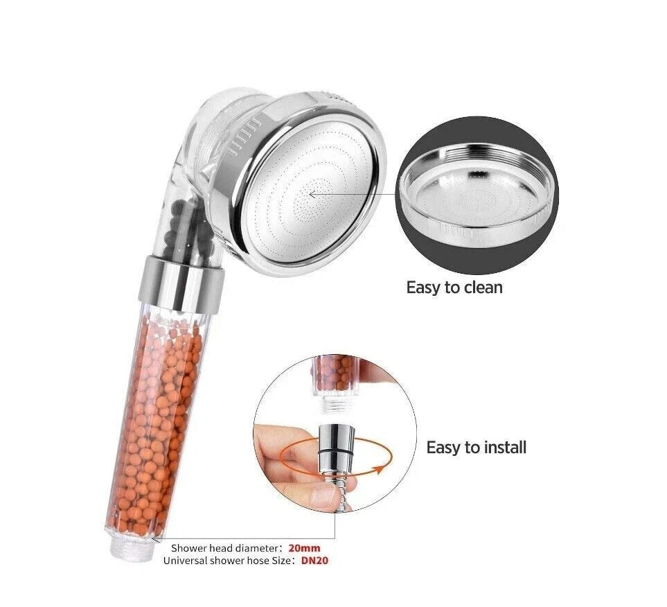 Chrome shower head with detachable spray face insert; amber bead-filled filter handle