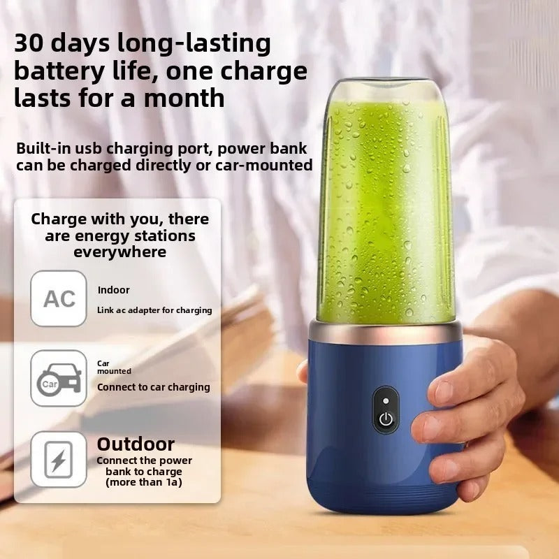 Blue portable mini blender cup with green drink and power button on base