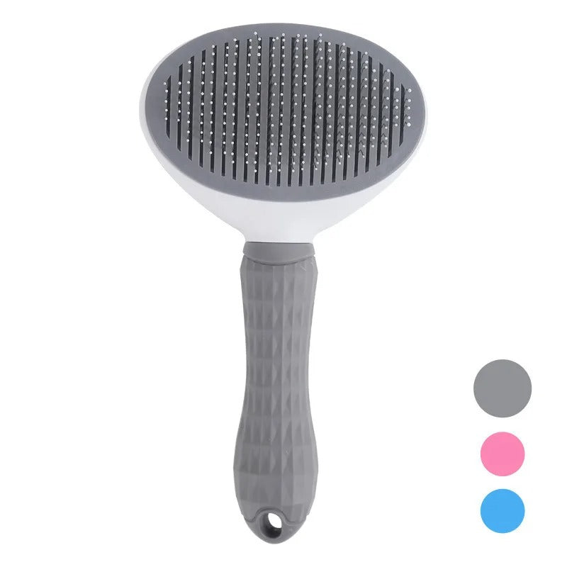 Pet grooming brush with dark bristle pad, white base, and textured gray handle
